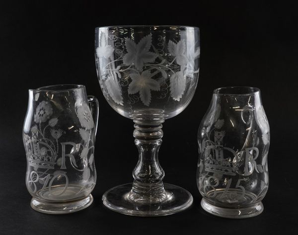 A PAIR OF ENGRAVED GLASS JUGS COMMEMORATING GEORGE III