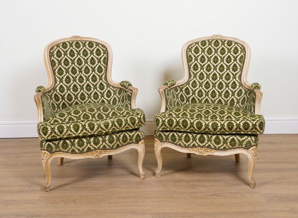 A PAIR OF CREAM PAINTED LOUIS XV STYLE TUB BACK EASY ARMCHAIRS (2)