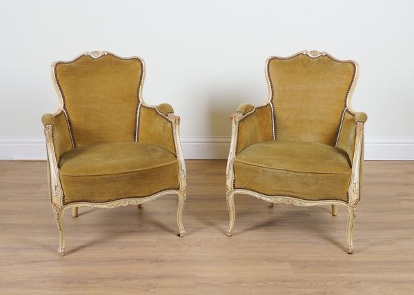 A PAIR OF CREAM PAINTED LOUIS XV STYLE TUB BACK EASY ARMCHAIRS (2)