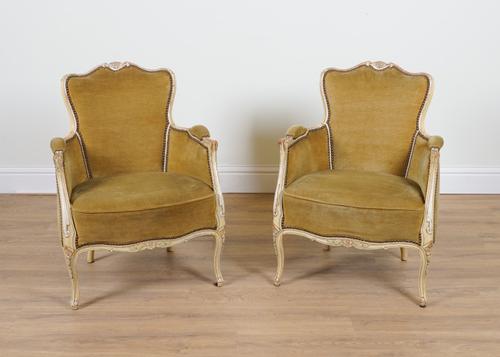 A PAIR OF CREAM PAINTED LOUIS XV STYLE TUB BACK EASY ARMCHAIRS (2)