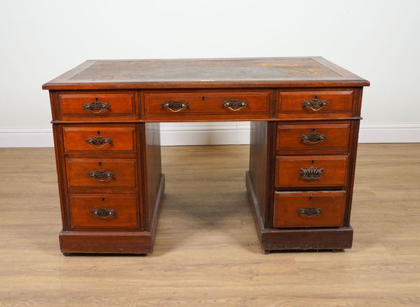 A LATE 19TH CENTURY WALNUT NINE DRAWER PEDESTAL DESK