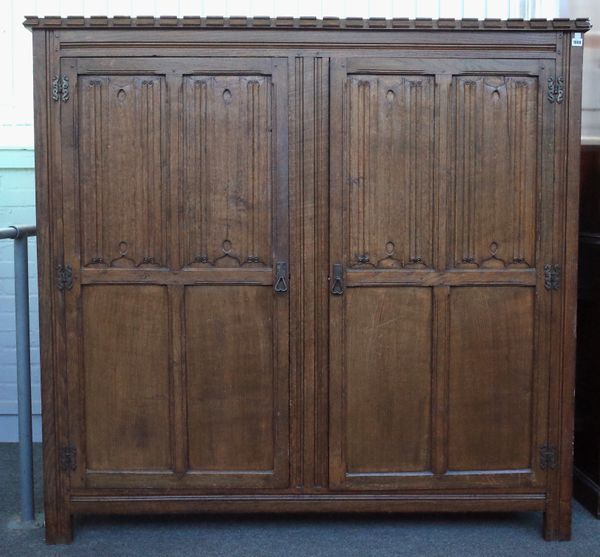 COTSWOLD SCHOOL; A 17TH CENTURY STYLE OAK HALL CUPBOARD