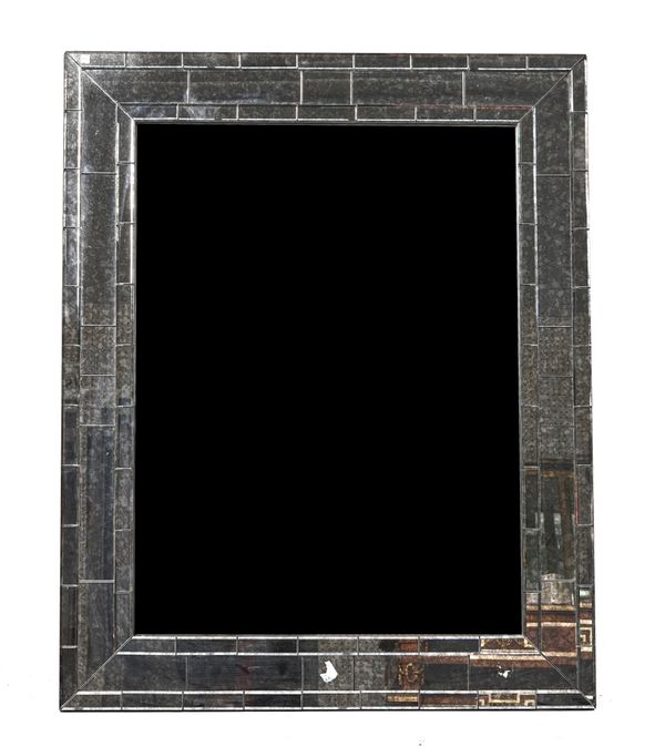 A MODERN RECTANGULAR WALL MIRROR