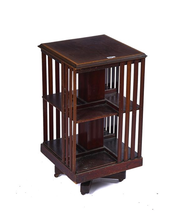 AN EDWARDIAN SATINWOOD BANDED MAHOGANY SQUARE REVOLVING BOOKCASE