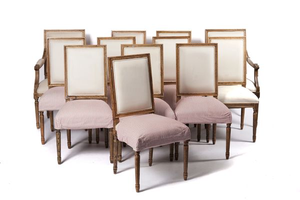 OKA; A SET OF TWELVE LOUIS XVI STYLE OAK FRAMED SQUARE BACK DINING CHAIRS (12)