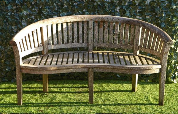 A HARDWOOD SEMI-ELLIPTIC GARDEN BENCH