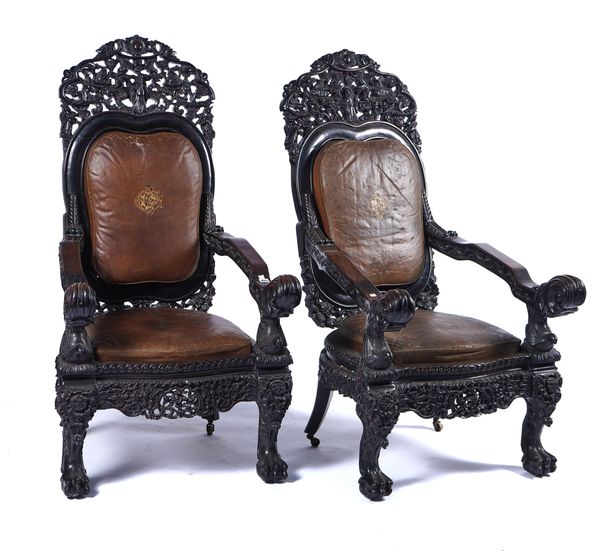 A PAIR OF CHINESE EXPORT HARDWOOD OPEN ARM THRONE CHAIRS (2)