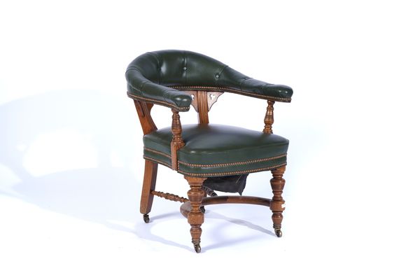 A VICTORIAN GOTHIC REVIVAL OAK FRAMED TUB BACK OFFICE CHAIR