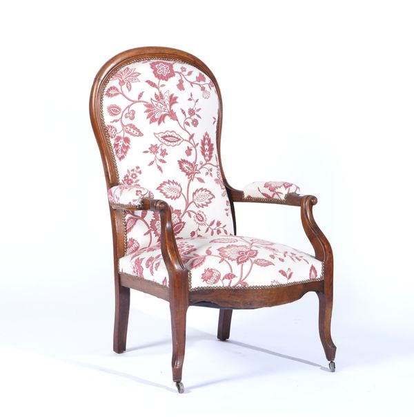 A 19TH CENTURY FRENCH WALNUT FRAMED SPOON BACK OPEN ARMCHAIR