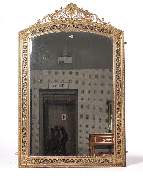 A LATE 19TH CENTURY GILT FRAMED ARCH TOP OVERMANTEL MIRROR