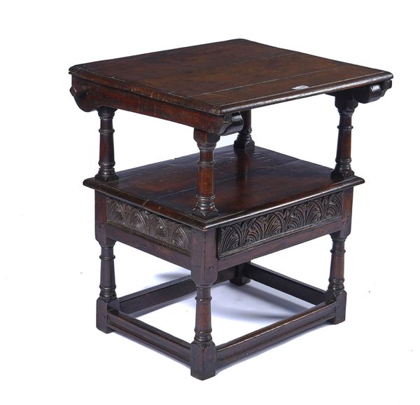 A 17TH CENTURY OAK MONKS CHAIR