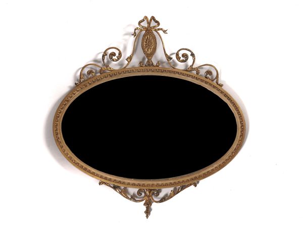 AN EARLY 20TH CENTURY NEOCLASSICAL REVIVAL GILT FRAMED OVAL WALL MIRROR