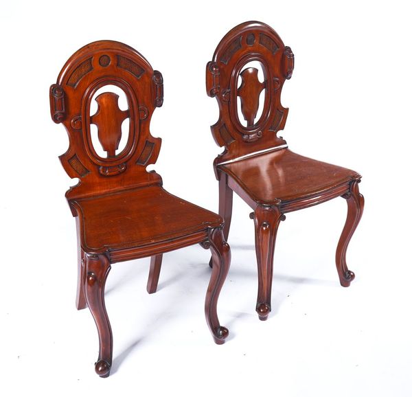 A PAIR OF VICTORIAN MAHOGANY HALL CHAIRS (2)