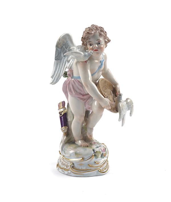 A MEISSEN FIGURE OF CUPID FEEDING DOVES