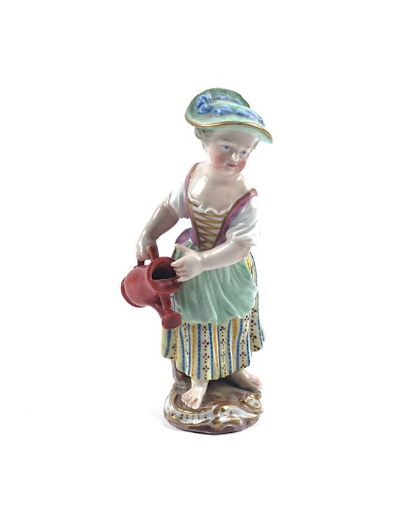 A MEISSEN FIGURE OF A CHILD GARDENER