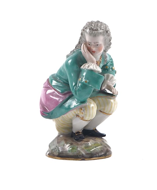 AN UNUSUAL MEISSEN FIGURE OF A MAN SQUATTING