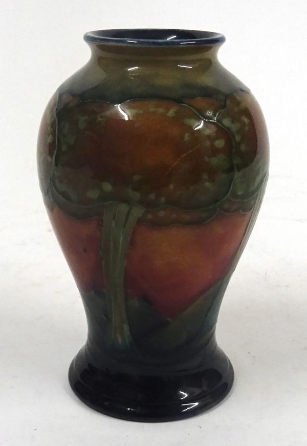 A SMALL MOORCROFT BALUSTER VASE