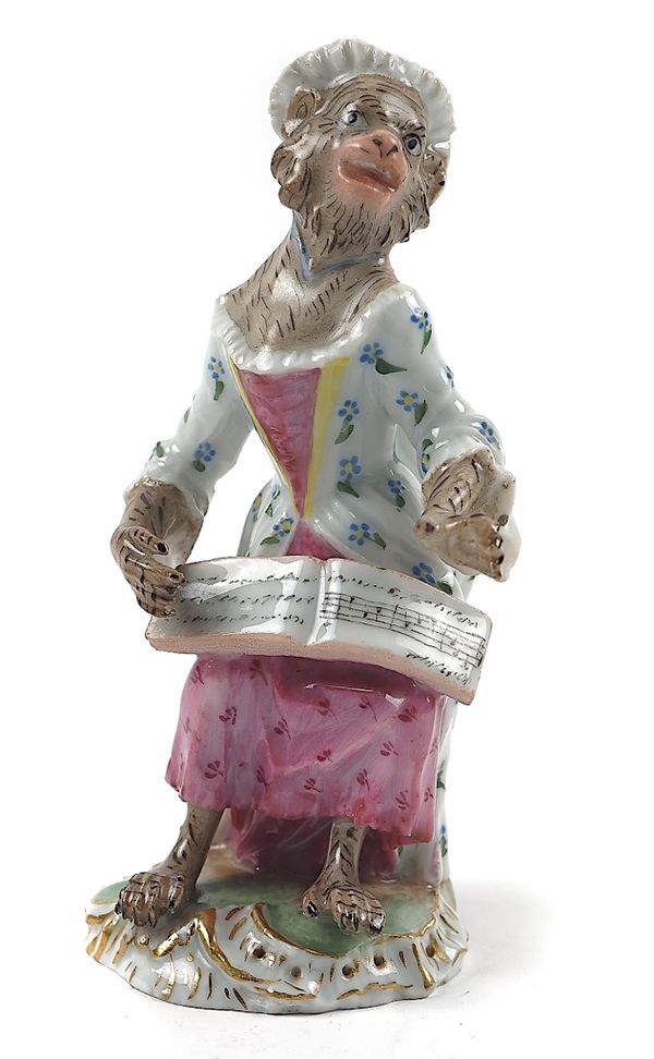 A MEISSEN MONKEY BAND SEATED FEMALE SINGER