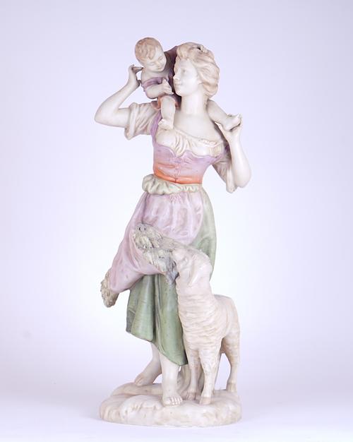 A LARGE CONTINENTAL PORCELAIN ROYAL DUX STYLE FIGURE OF A SHEPHERDESS