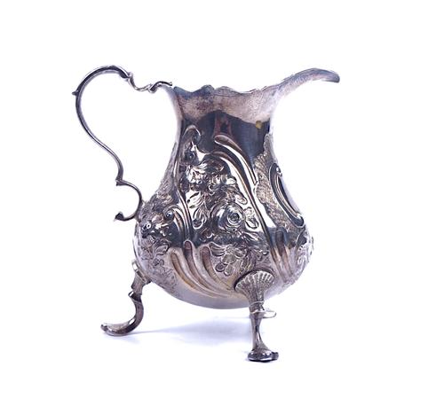 A GEORGE III SILVER CREAM JUG