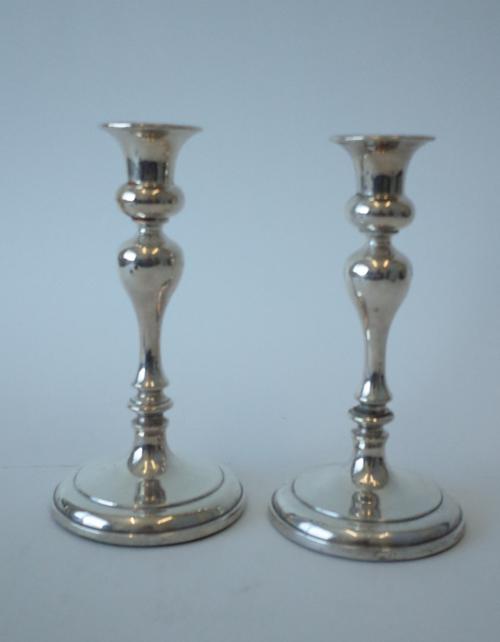 A PAIR OF SILVER TABLE CANDLESTICKS (2)