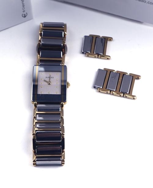 RADO: A LADY'S TITANIUM AND GILT METAL DIASTAR BRACELET WRISTWATCH