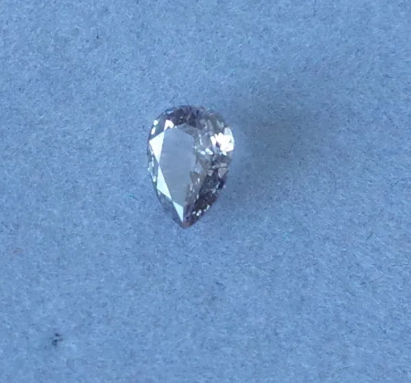 AN UNMOUNTED PEAR SHAPED NATURAL FANCY BROWN/PINK DIAMOND