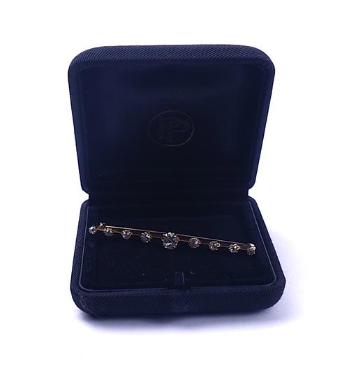 A GOLD AND DIAMOND BAR BROOCH
