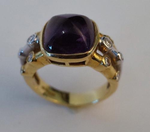 AN 18CT GOLD, AMETHYST AND DIAMOND RING