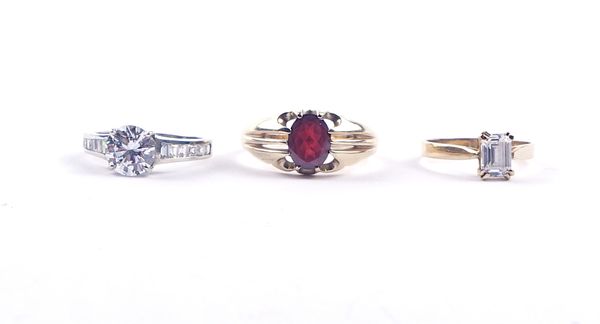 A 9CT GOLD AND GARNET RING AND TWO FURTHER RINGS (3)