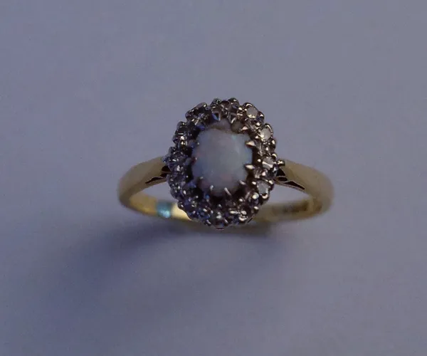 AN 18CT GOLD, OPAL AND DIAMOND OVAL CUSTER RING