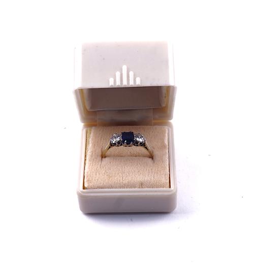 A GOLD AND PLATINUM, SAPPHIRE AND DIAMOND THREE STONE RING