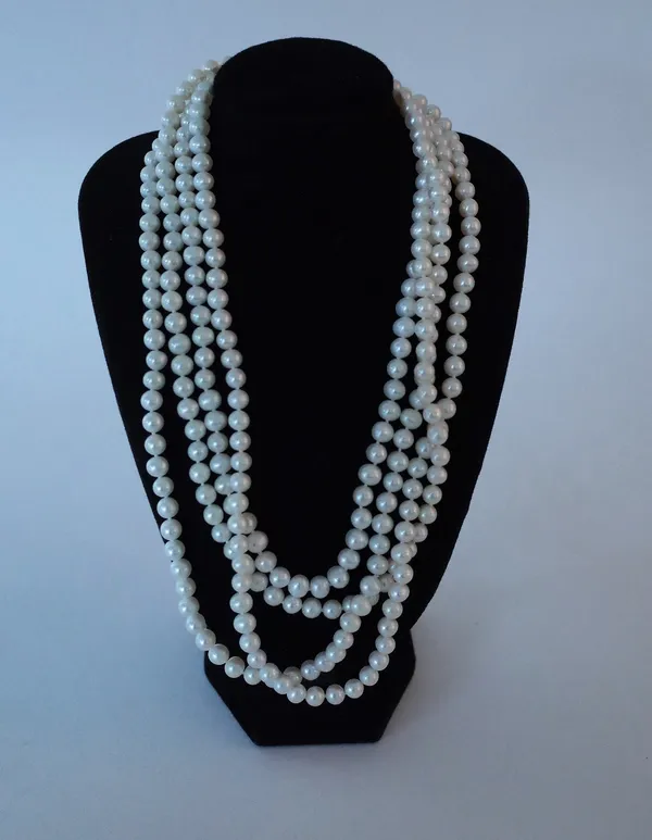 A LONG SINGLE ROW NECKLACE OF FRESHWATER CULTURED PEARLS