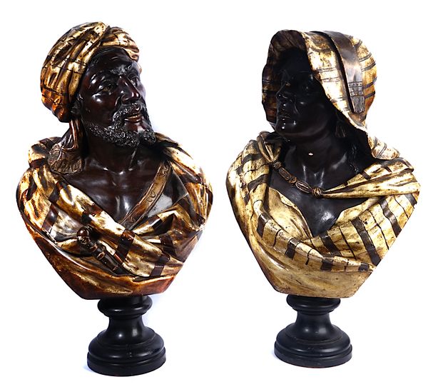 A MATCHED PAIR OF AUSTRIAN PAINTED TERRACOTTA BUSTS OF A NORTH AFRICAN MAN AND WOMAN (2)