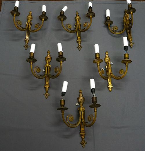 A SET OF SIX LOUIS XVI GILT-METAL TWIN LIGHT WALL APPLIQUÉS (6)