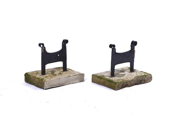 A PAIR OF WROUGHT IRON AND STONE BOOT SCRAPERS (2)
