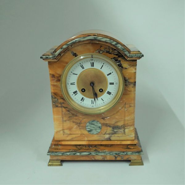 A FRENCH GIALLO SIENA AND CIPOLLINO MARBLE MOUNTED MANTEL CLOCK