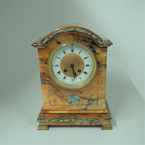 A FRENCH GIALLO SIENA AND CIPOLLINO MARBLE MOUNTED MANTEL CLOCK