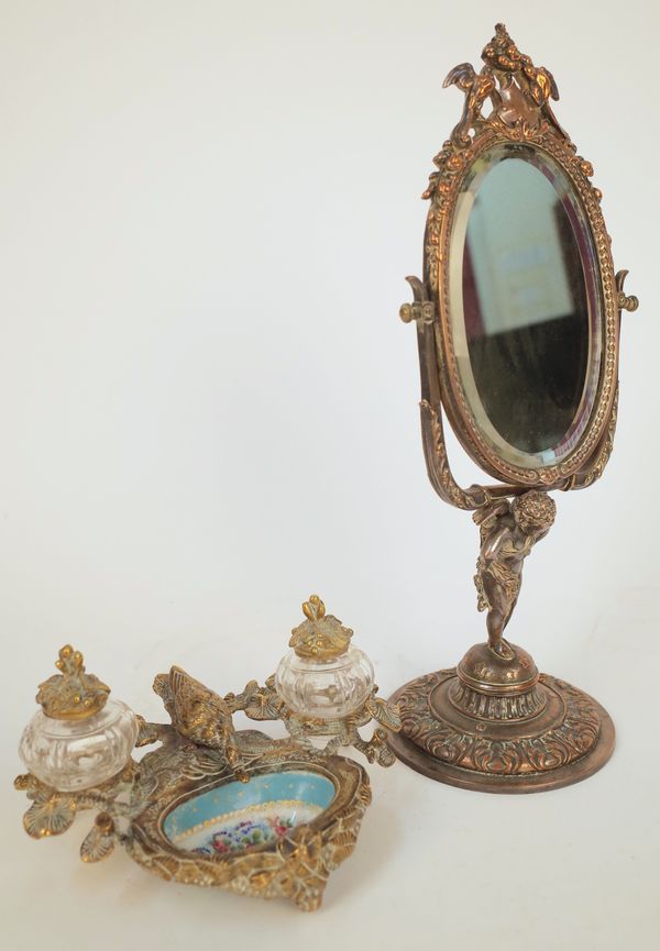 A FRENCH SILVER-PLATED TOILET MIRROR AND A GILT-METAL MOUNTED SEVRES STYLE CERAMIC INKSTAND (2)