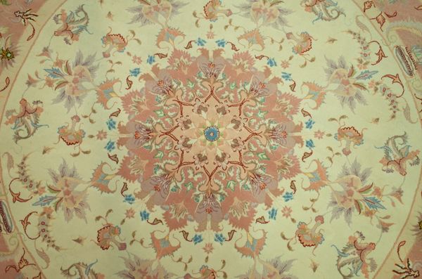 A PART SILK TABRIZ CIRCULAR RUG