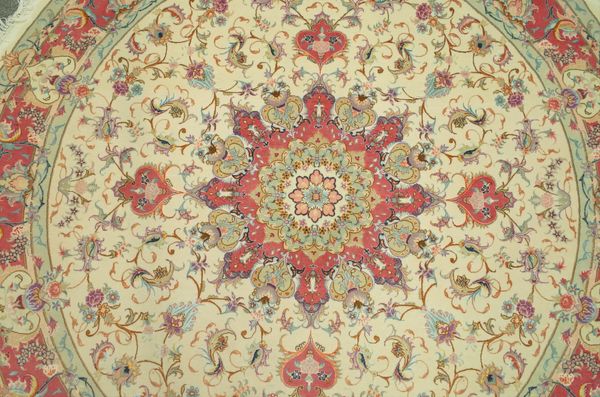 A FINE PART SILK TABRIZ CIRCULAR RUG