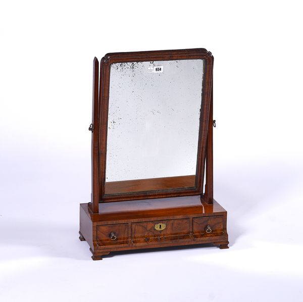 A GEORGE II FIGURED WALNUT TOILET MIRROR