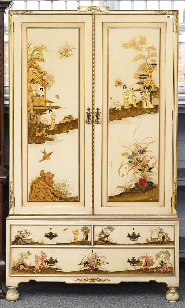 WARING AND GILLOW LTD; A MID 20TH CENTURY WHITE LACQUERED CHINOISERIE DECORATED LINEN PRESS