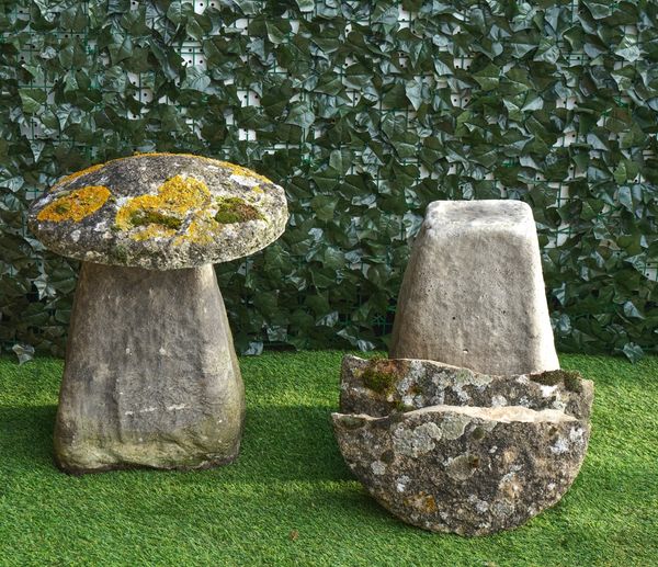 A PAIR OF CARVED STONE STADDLE STONES (2)