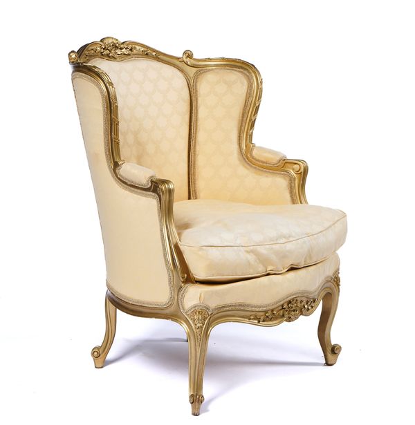 A LOUIS XV STYLE GILT FRAMED TUB BACK ARMCHAIR