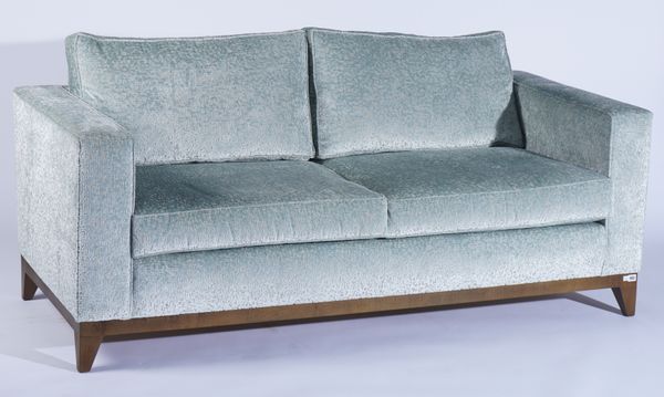 A MODERN SQUARE BACK THREE SEAT SOFA