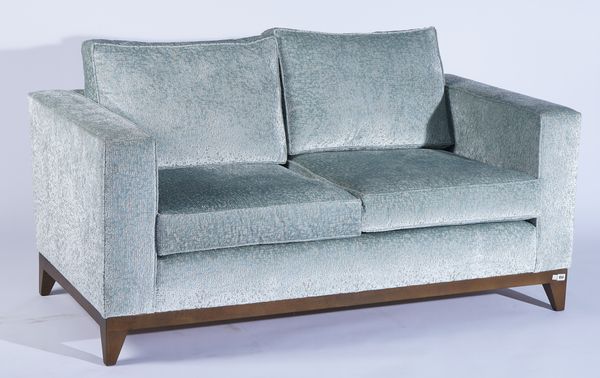 A MODERN SQUARE BACK TWO SEAT SOFA