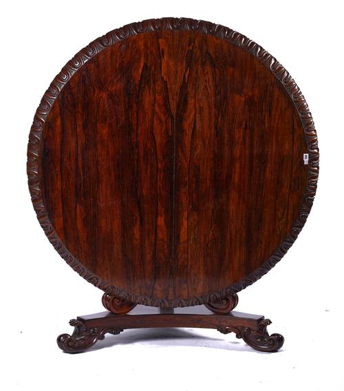 A REGENCY ROSEWOOD CIRCULAR SNAP-TOP CENTRE TABLE