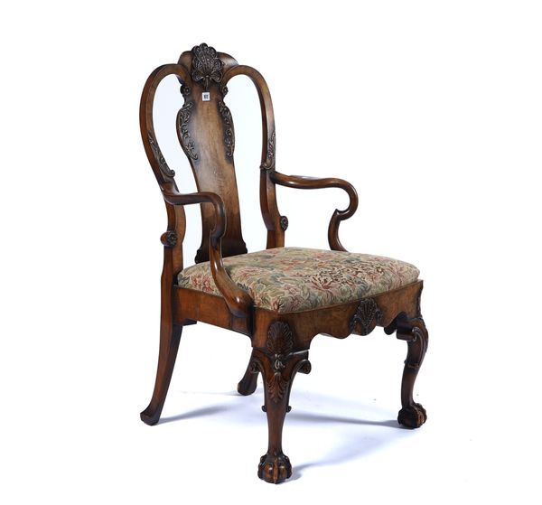 C. BARKER; A QUEEN ANNE STYLE WALNUT FRAMED OPEN ARMCHAIR