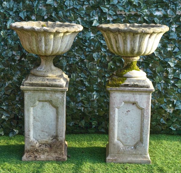 A PAIR OF RECONSTITUTED STONE JARDINIERES (2)